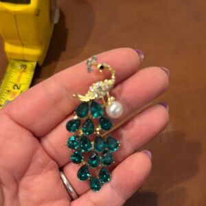 Aratta Elegant Gold and Green Peacock brooch